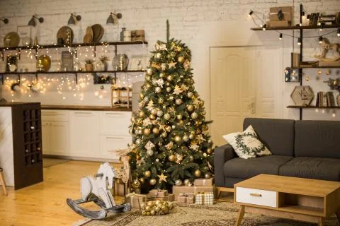 Christmas interior with elegant Christmas tree and rocking horse Stock Photos