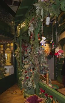 Christmas interior in the store: with a large tree in toys, gingerbread houses. 写真素材