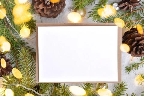 Christmas invitation with bokeh. Layout with an envelope and an empty space. Stock Photos