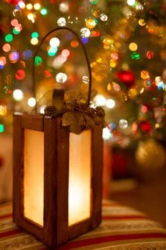 Christmas lantern with magic warm lights in the background Stock Photos