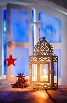 Christmas lantern in window Stock Photos