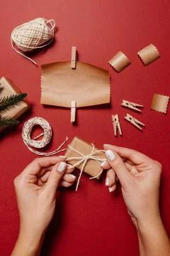 Christmas layout ecological packaging on a red background Stock Photos
