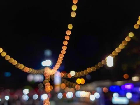 Christmas light blur background - light bokeh from Xmas decoration on pole at Stock Photos