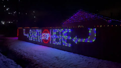Christmas light on the wall Santa Stop Here Sign Stock Footage 257077089