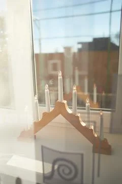 Christmas light at the window. Stock Photos