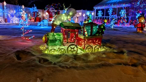 Christmas lighted train front yard winter snow, still/life video loop Stock Footage 140933668