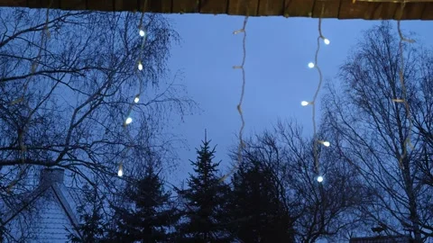 Christmas lights and the evening sky Stock Footage 324992044