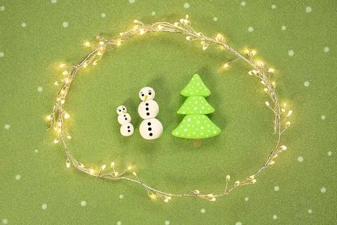 Christmas lights, with cute snowmen and christmas tree. Seasonal christmas ba Stock Photos