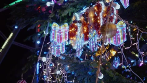 Christmas lights on a decorated tree in a festive location Stock Footage 346698853