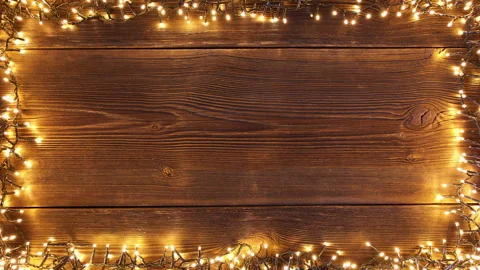 Christmas lights frame loop on rustic wooden background. Stock Footage 284274631