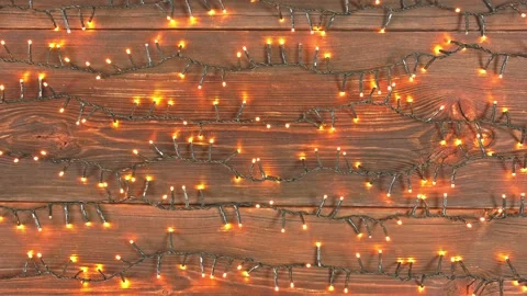 Christmas lights loop on rustic wooden background. Stock Footage 320712170