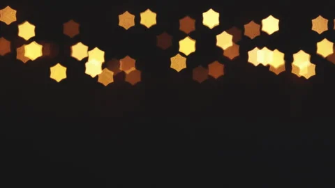 Christmas lights loop. Star-shaped out of focus lights. Stock Footage 284451327