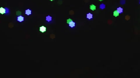 Christmas lights loop. Star-shaped out of focus lights. Stock Footage 284455096