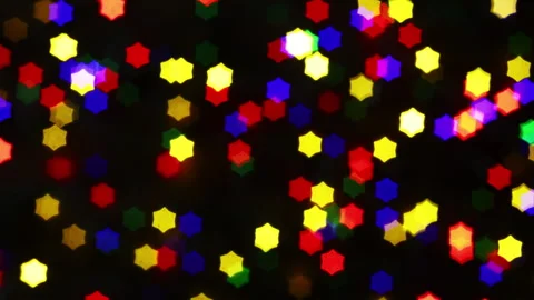 Christmas lights loop. Star-shaped out of focus lights. Stock Footage 284464479