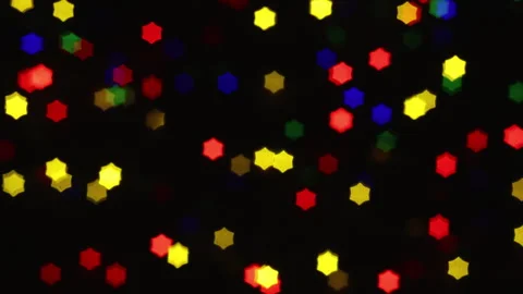 Christmas lights loop. Star-shaped out of focus lights. Stock Footage 284464581