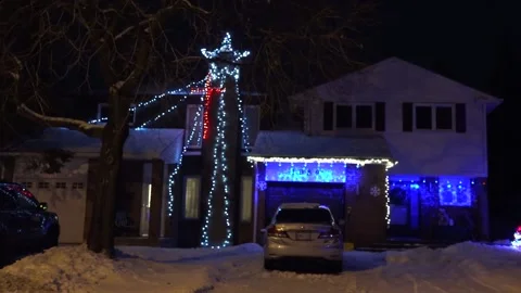 Christmas lights on regular homes in the suburbs Stock Footage 145144305