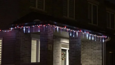 Christmas lights on regular homes in the suburbs Stock Footage 145145178