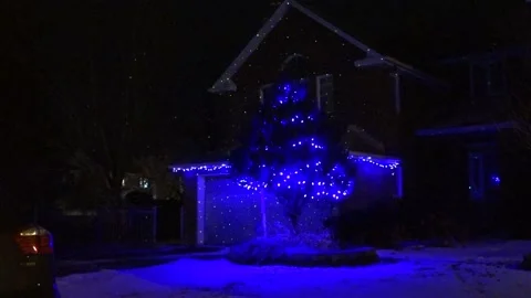 Christmas lights on regular homes in the suburbs Stock Footage 145197086