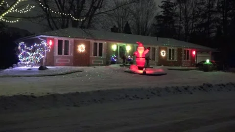Christmas lights on regular homes in the suburbs Stock Footage 145197404
