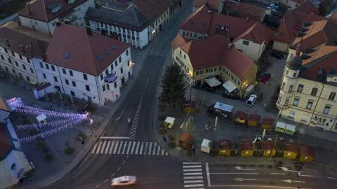 Christmas lights switch on in main square of small town, aerial time-lapse of Stock Photos