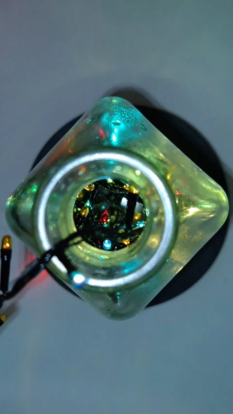 Christmas lights in a transparent bottle top view neon light Видео 323761545