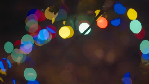 Christmas lights on trees with camera rotating right then left Stock Footage 334031105