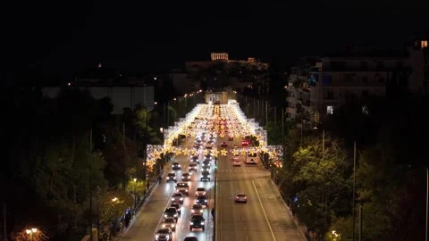 Christmas-Lit Vasilisis Sofias Road Rising to Reveal the Illuminated Acropolis Stock Footage 325181747
