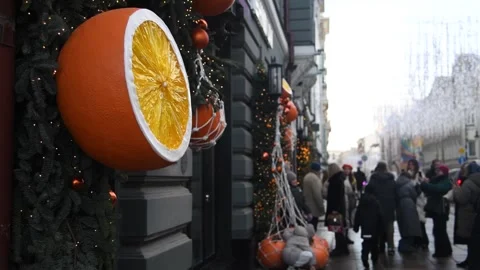 Christmas mandarin orange fruit decorations on city street Stock Footage 297119966