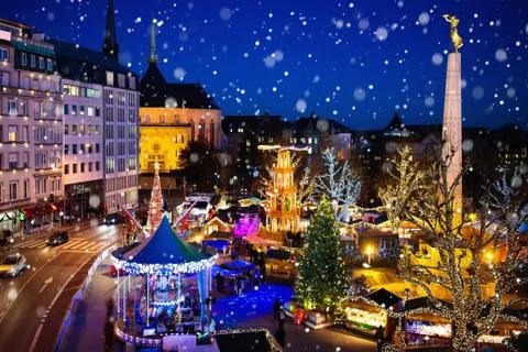 Christmas market. Winter fair with tree and lights. Stock Photos