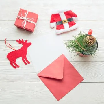 Christmas message concept. White blank paper card with Christmas objects on Stock Photos