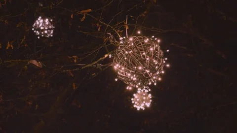 Christmas mistletoe light exterior evening in the rain warm color suggestion Stock Footage 83402656