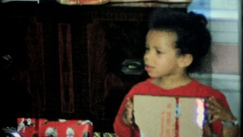Christmas morning with African American family 1950s vintage home movie 4059 Stock Footage