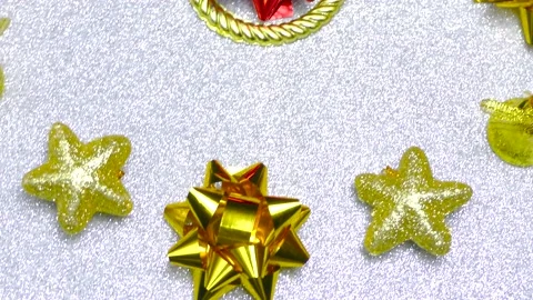 Christmas in motion close up of christmas decorations on white surface Stock Footage 166340296