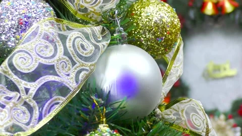 Christmas in motion close-up a Christmas tree spins near a Christmas wreath Video stock 166345459