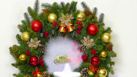 Christmas in motion close-up Christmas wreath with an inscription Stock Footage 166344374