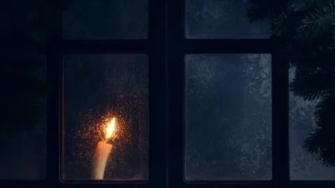 Christmas, new year, winter composition. Candle behind a frozen window Stock Footage 222008089