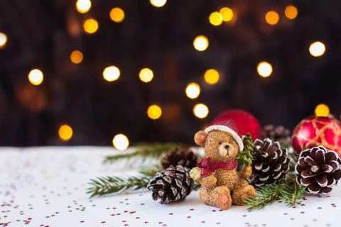 Christmas new year's composition. A bear in a red cap and red Christmas tree  Foto stock