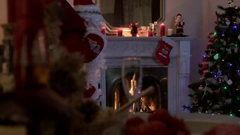 On Christmas night, the fireplace with decorations burns. Stock Footage 169028401
