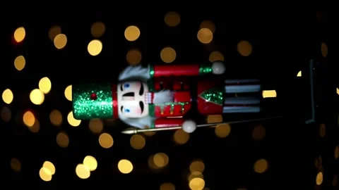 Christmas nutcracker with Christmas bokeh in background Stock Footage 229940179