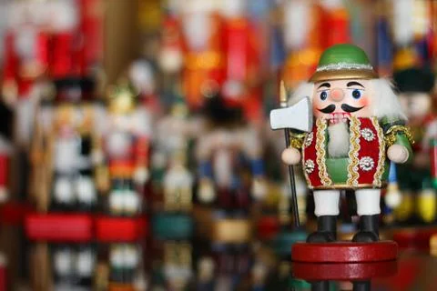 Christmas nutcracker in front of collection of toy soldiers Stock Photos