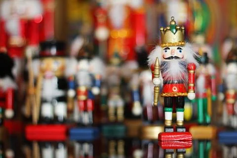 Christmas nutcracker in front of collection of toy soldiers Stock Photos