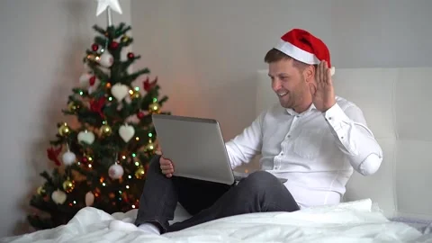 Christmas online family congratulations. man notebook for video call his family Stock Footage