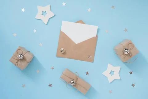Christmas or winter composition with craft envelope and white decorations on Stock Photos