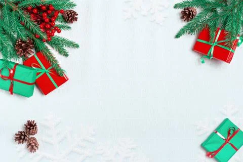 Christmas or winter composition. Frame made of snowflakes and red berries on  Stock Photos