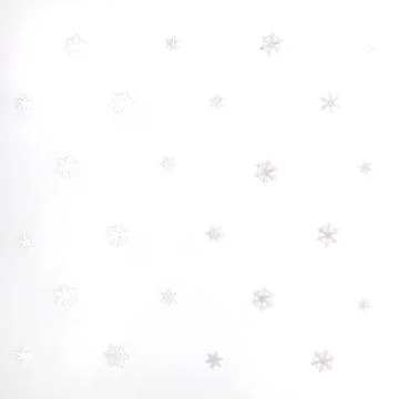 Christmas or winter composition. Pattern made of white snowflakes on white ba Stock Photos