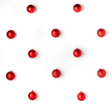 Christmas or winter composition. Pattern made of red balls on white backgroun Stock Photos