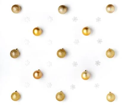 Christmas or winter composition. Pattern made of golden balls and white snowf Stock Photos