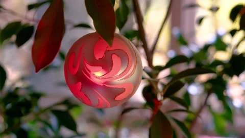 Christmas ornament hanging with blinking holiday lights Stock Footage 348694553