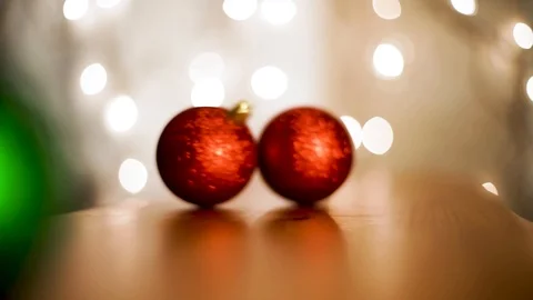 Christmas ornaments bouncing and rolling into frame_3 Stock Footage 99207560