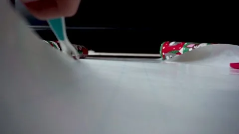 Christmas Paper Being Cut Down the Middle Stock Footage
